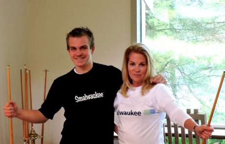2 people wearing posing wearing smalwaukee shirts