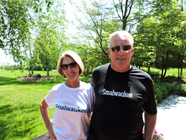 2 people smiling wearing smalwaukee shirts